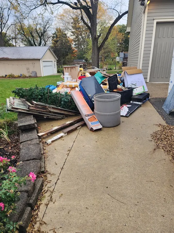 Dumpster being loaded with debris for Commercial Dumpster Rental in Lynchburg